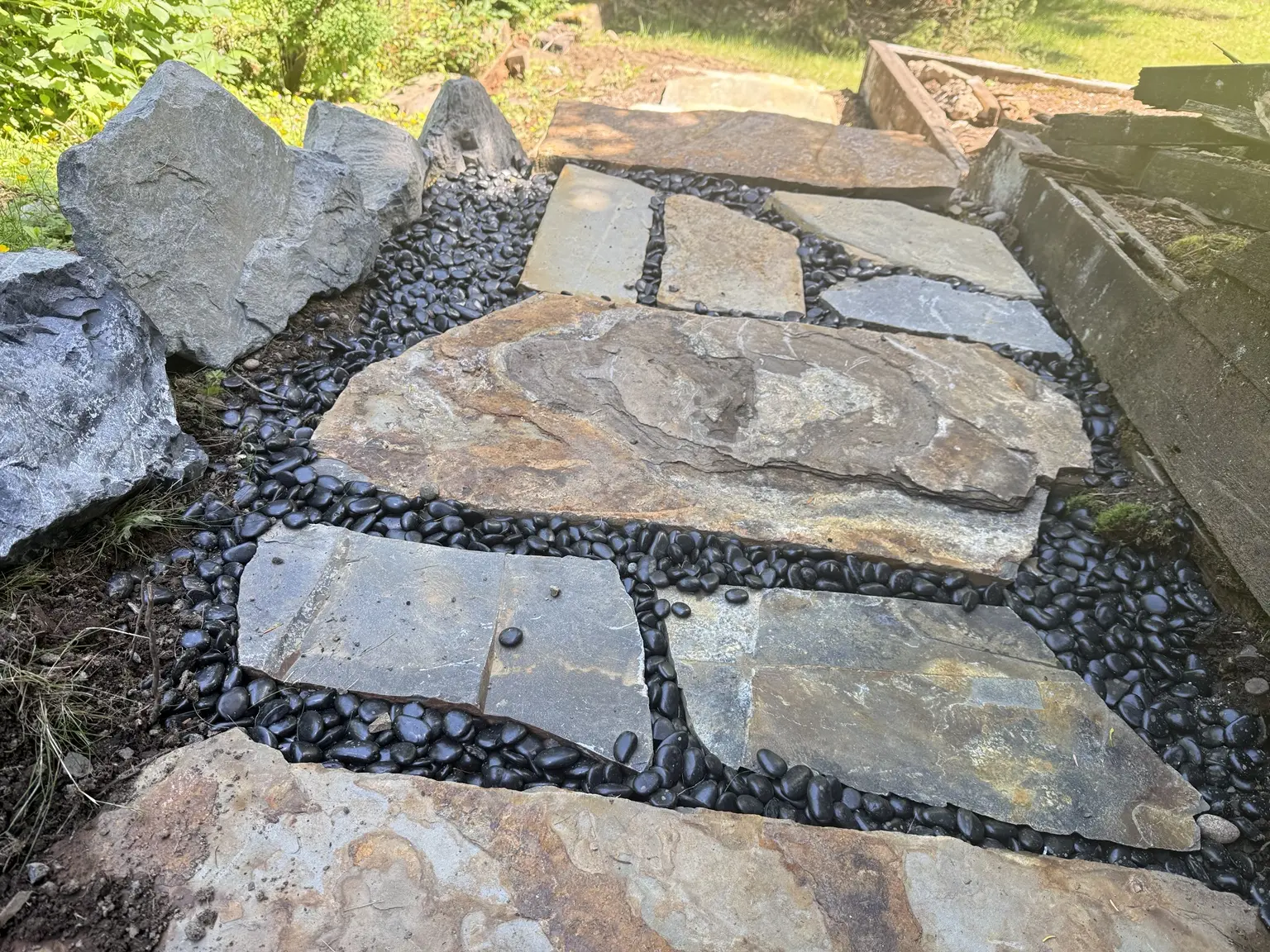 Close view of flat stone landing pieces fitted between large stone steps